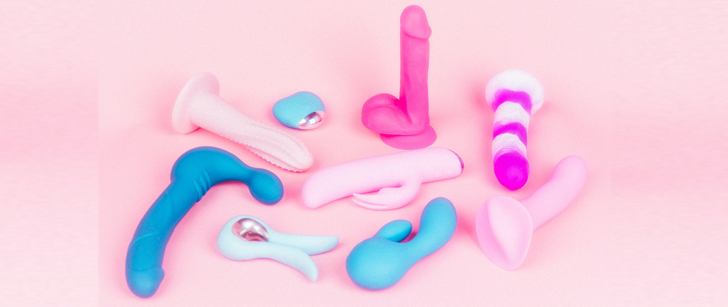 sex toys against pink background