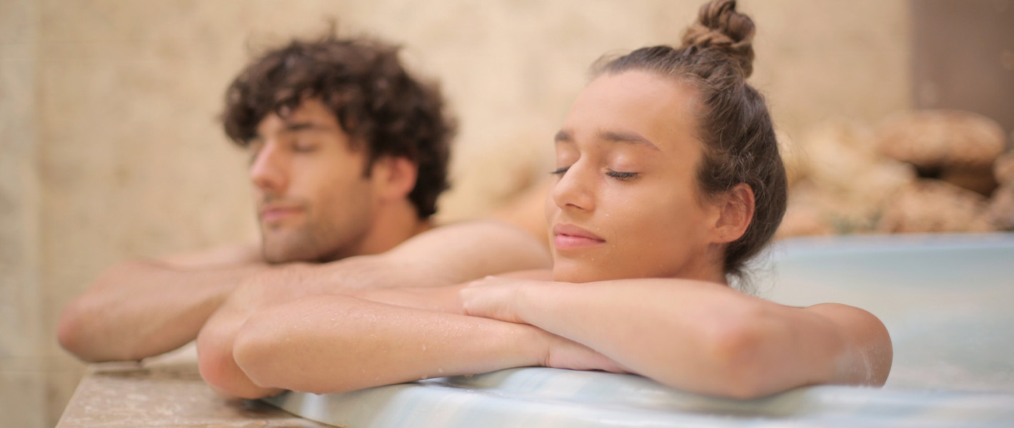 couple relaxing in hot tub