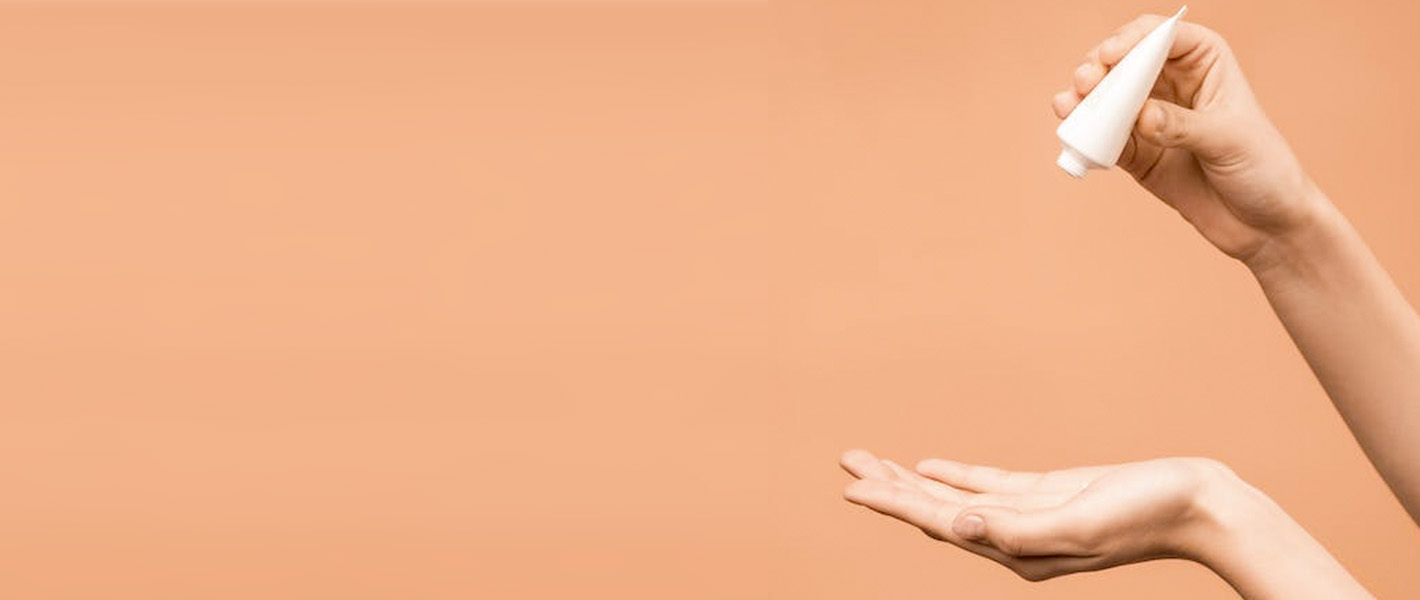 person applying liquid to hands