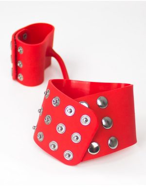 close up red studded silicone handcuffs wristcuffs