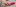 hand reaching for sex toy on bedside table