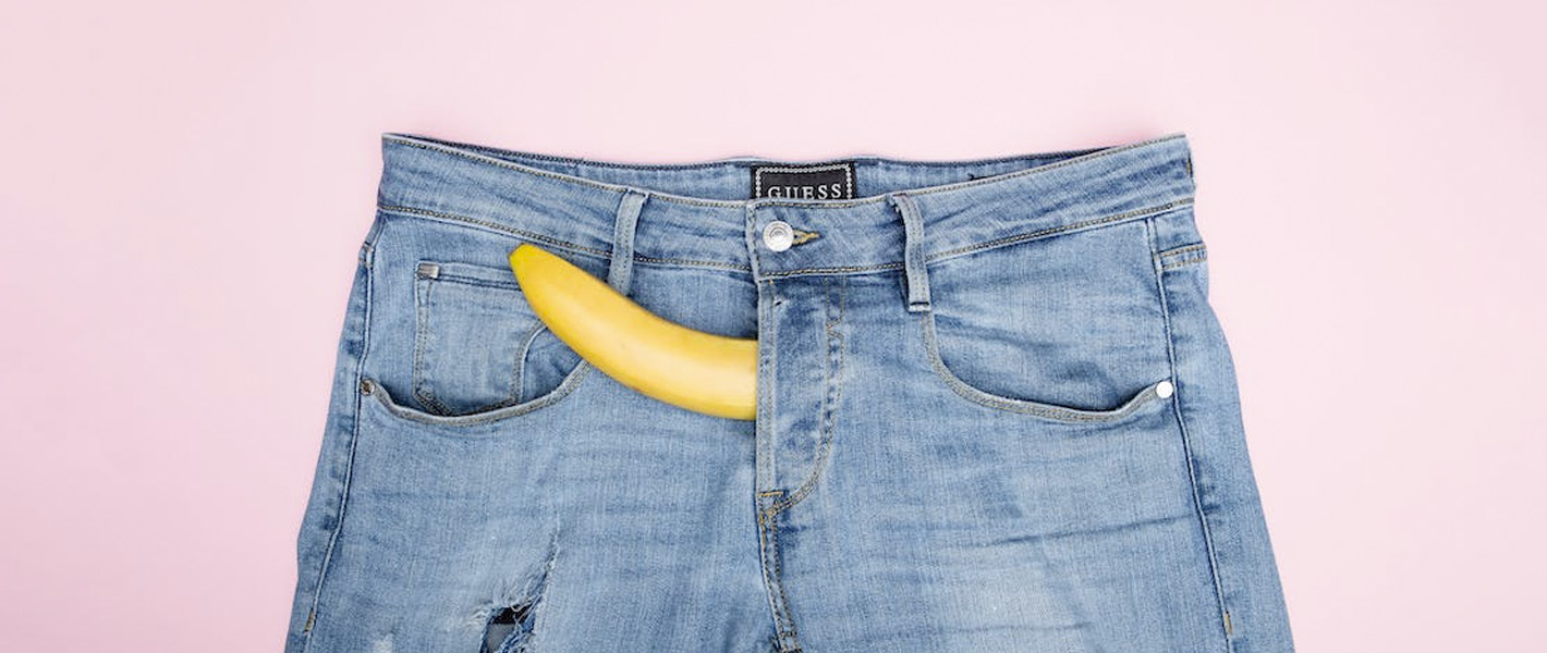 banana poking out of jeans.
