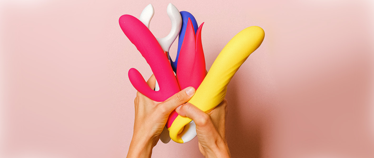 hands holding sex toys