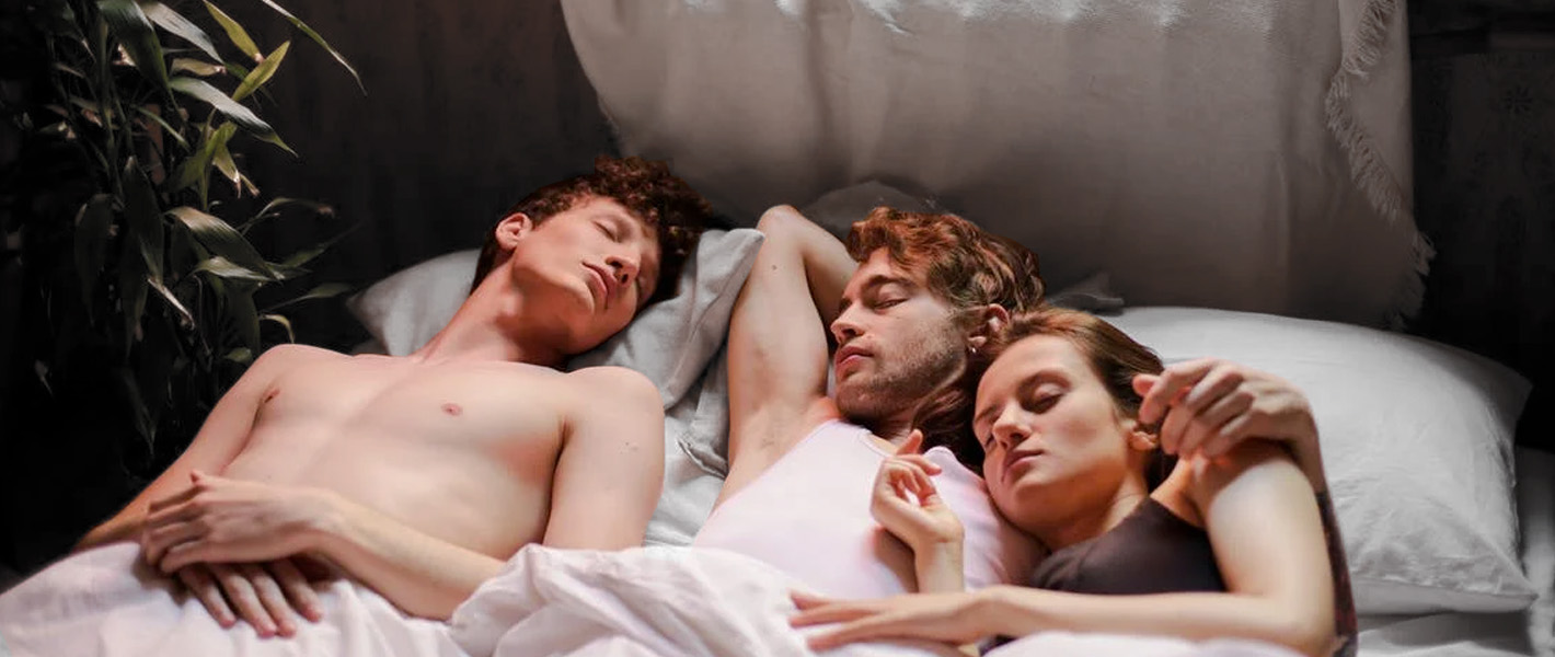 throuple in bed